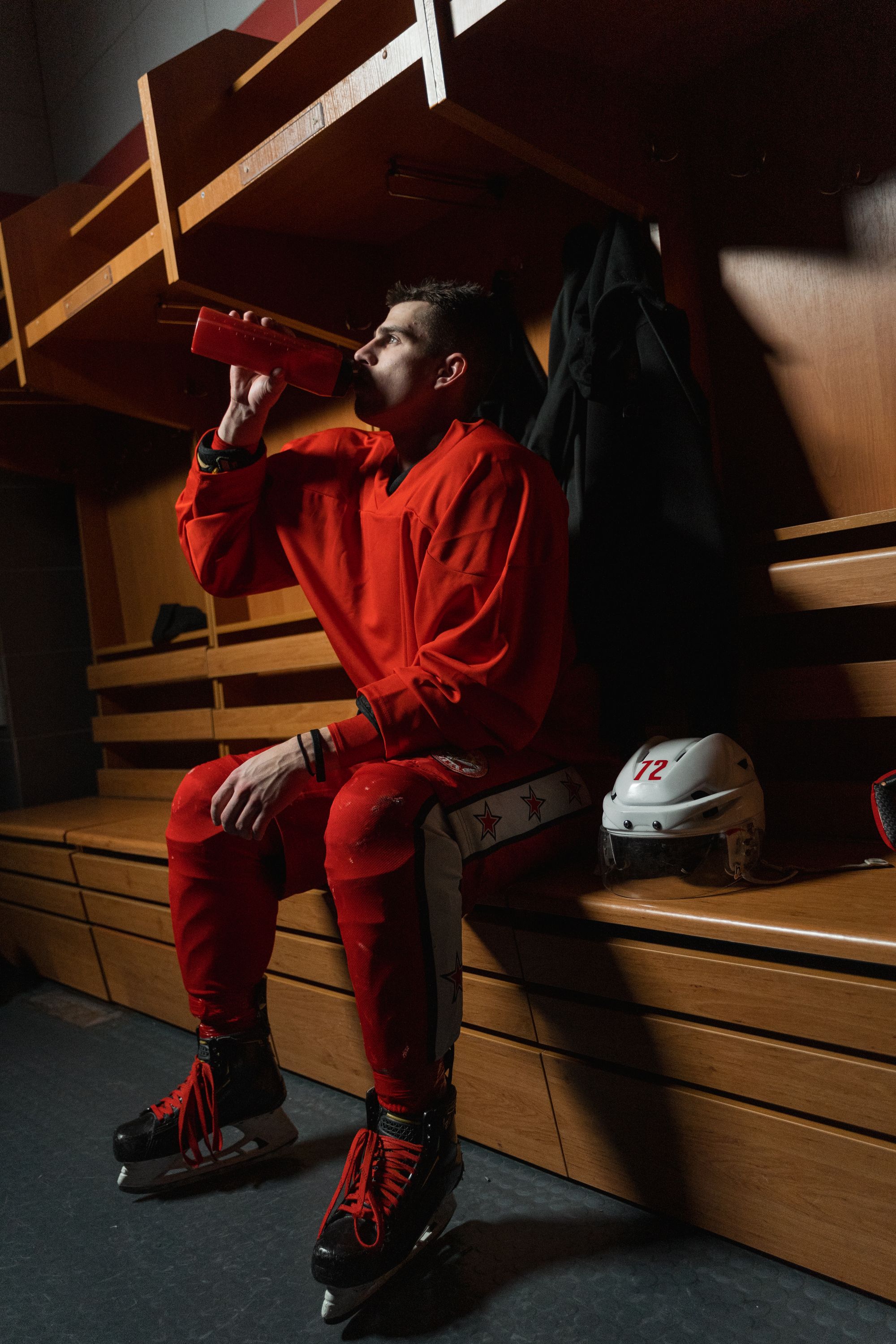 Squeeze bottle in use on a locker-room bench