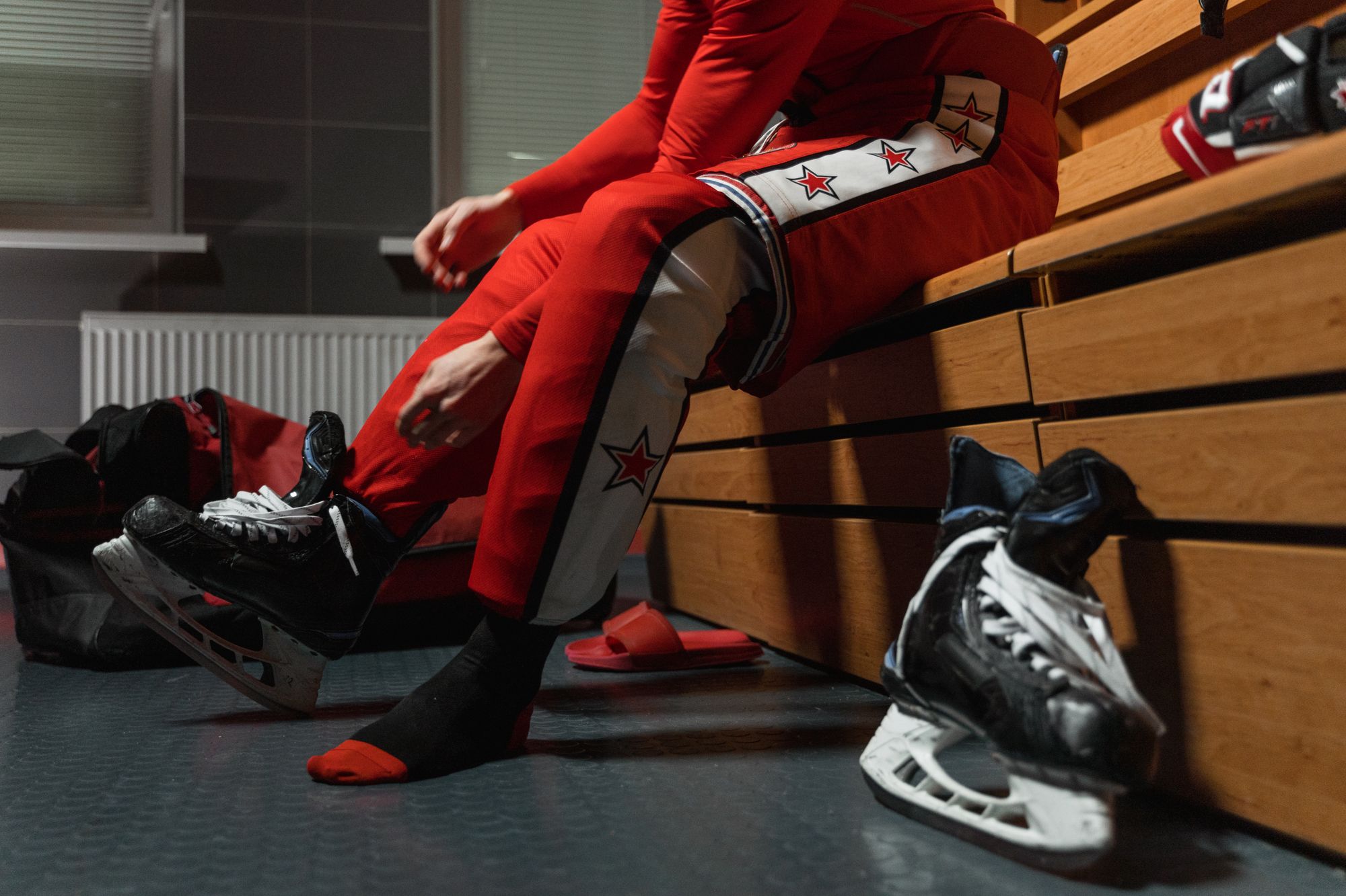 Dressing-room bench with kit bag and skates